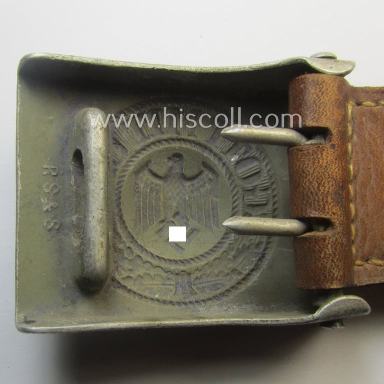 WH (Heeres) 'standard-pattern', field-grey-toned- and aluminium-based belt-buckle being a maker- (ie. 'R. Sieper & Söhne'-) marked- and/or: '1937'-dated example that comes mounted onto its leather-based tab