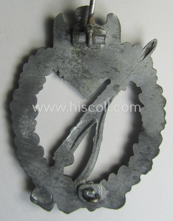 'Infanterie Sturmabzeichen in Silber' being a non-maker-marked and/or typical zinc- (ie. 'Feinzink'-) based version (ie. 'crimped scooped rifle-variant') as was (I deem) procuded by the: 'S&L'- (ie. 'Steinhauer u. Lück'-) company