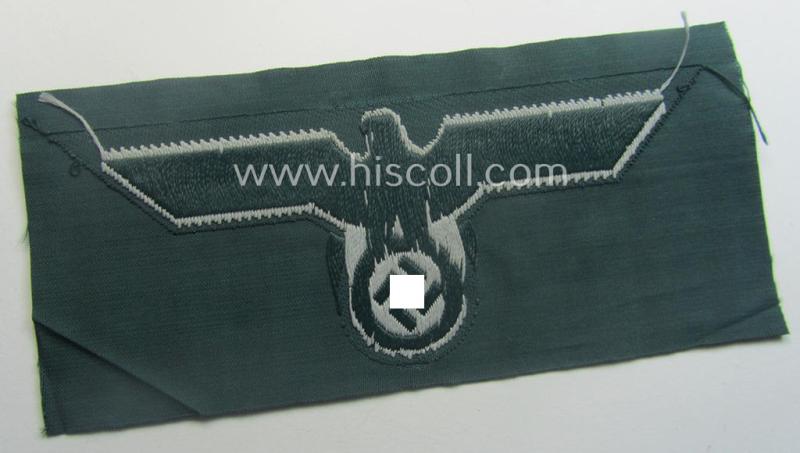 WH (Heeres) early- (ie. pre-war-) period- and/or greyish-coloured breast-eagle of the: 'M36'- (ie. 'M40'-) pattern as was executed in the 'BeVo'-weave pattern on a darker-green-coloured background