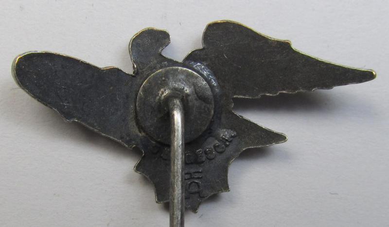 Semi-enamelled RLB- (ie. 'Reichluftschützbund') 'Amtsträger-Abzeichen' ie.: civil-attire badge (of the second pattern) being a maker- (ie. 'HA'-) marked example that is additionally bearing a patent-pending- (ie. 'Ges.Gesch.'-) marking on its...