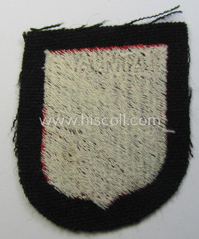 Waffen-SS 'volunteer'-arm-shield as was intended for usage by soldiers of the: '15. o. 19. Waffen-Grenadier-Division der SS' (ie. 'lettische nr. 1 o. 2') and that comes in a 'virtually mint- ie. unissued', condition