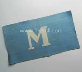 Linnen-based- and/or light-blue-coloured armband (ie. 'Armbinde') depicting an...