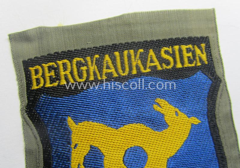 'BeVo'-type armshield (of the second pattern!) entitled: 'Bergkaukasien', being a piece as intended for a volunteer who served within the 'Deutsche Wehrmacht' ie. within the 'Berg- o. Nord-Kaukasisches Legion'