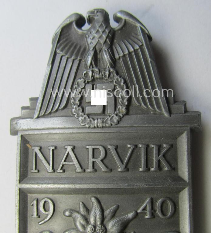 'Virtually mint' - albeit regrettably incomplete - example of a WH (Heeres, LW ie. Waffen-SS) 'Narvik'-campaign-shield as executed in typical: 'Feinzink' (as was presumably produced by the: 'Wilhelm Deumer'-company)