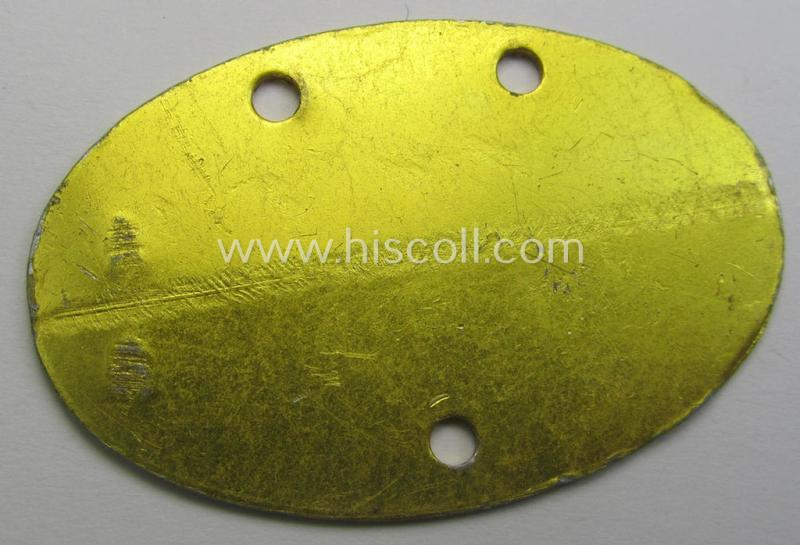 WH (KM) typical aluminium-based- and/or bright golden-bronze toned ID-disc (ie. 'Erkennungsmarke') bearing the engraved name and coded numeral (ie. text) that simply reads: 'Hinrich Schwarting N 2906 MK'