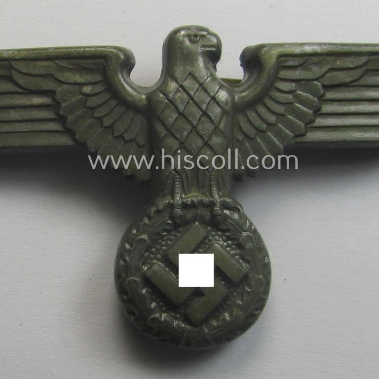 Greyish-silver-coloured- and/or: typical zinc- (ie. 'Feinzink'-) based (political-style) visor- (ie. 'Schirmmützen'-) cap-eagle being a detailed example that is neatly: 'RzM' and/or: 'M1/49' marked on its back