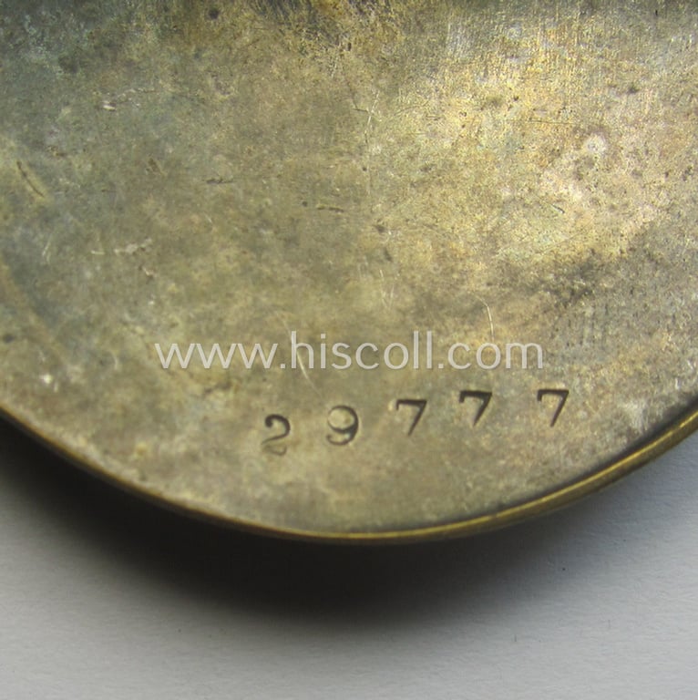 'Deutscher Frauenarbeitsdienst' (or: womens'-labour-service) so-called: 'Dienstbrosche' being a non-maker-marked example as was executed in silverish-golden-toned metal and that is bearing a unique serial-number ('29777')