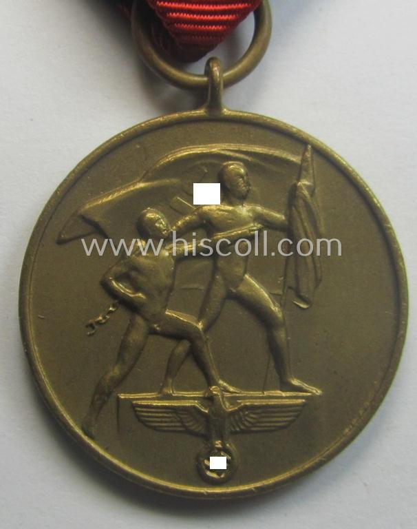 Hardly used, WH Czech-occupation- (ie. 'Anschluss'-) medal: '1. Oktober 1938' that comes stored in its bordeaux-red-coloured- and/or non-maker-marked etui as issued