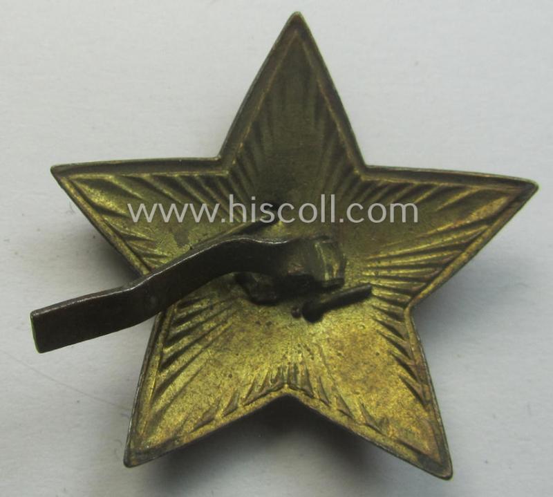 Unusal item that originated from a German soldier: a Russian, larger-sized and/or WWII-period, enamelled star-shaped cap-badge showing the communist logo on a bright-red-coloured surface