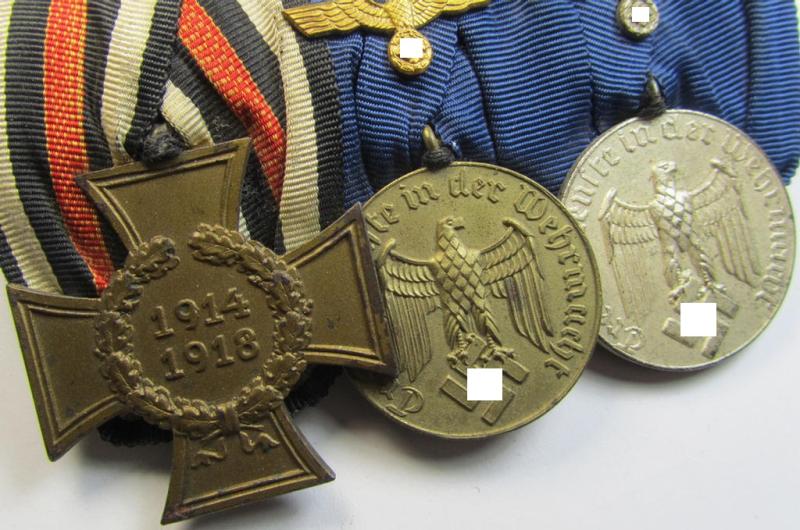 Attractive, 3-pieced medal-bar (ie. 'Ordenspange') showing resp. a WWI-period: 'FKK 1914-18 ohne Schw.' and two WWII-period: WH (Heeres or KM) so-called: 'Dienstauszeichnungen für 4 u. 12 Jahre Treue Dienste'