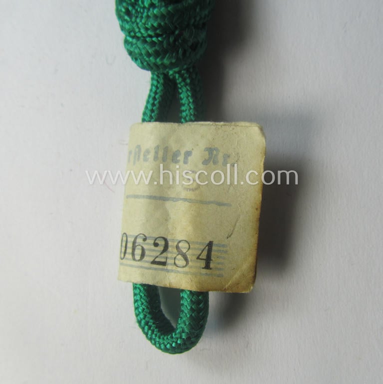 HJ/DJ (ie. 'Hitlerjugend' etc.) so-called: 'leaders-lanyard' (ie. 'Führerschnur') as was intended for usage by a youth-member holding the rank of: 'HJ-Scharführer' (ie. 'DJ-Jungzugführer') still retaining its 'RzM'-etiket