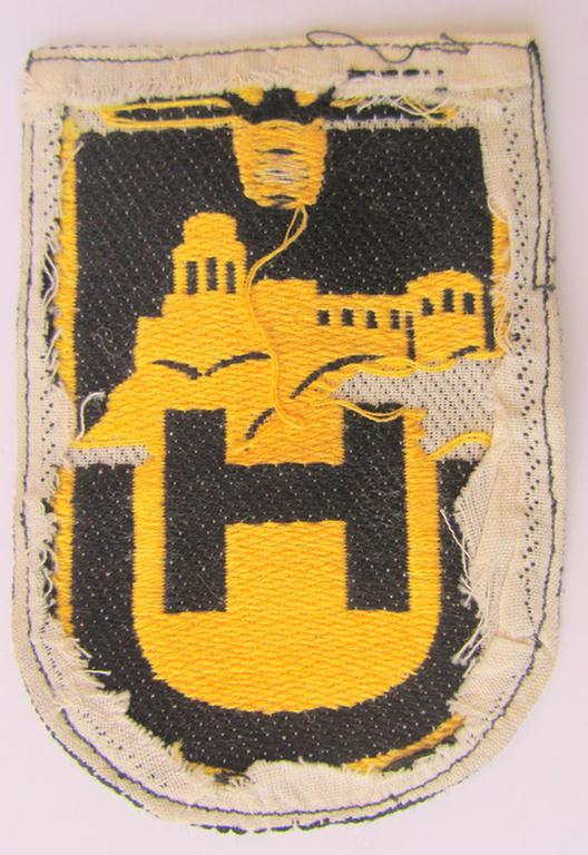 Superb - and truly very unusual and only once before encountered! - linnen-based- and/or: 'BeVo'-woven cloth-based sportshirt-patch depicting a capital: 'H' and 'U', as was intended for usage by students serving within the: 'Universität Heidel...