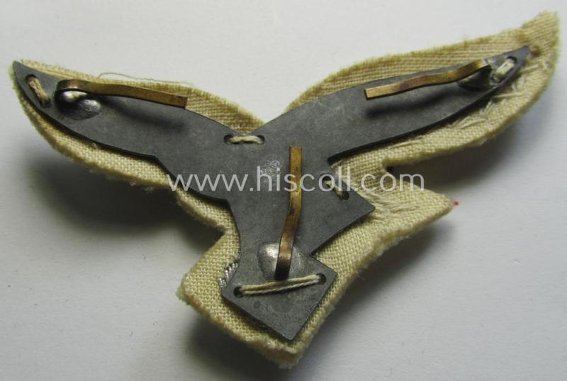 WH (Luftwaffe) officers'-type visor-cap eagle that is neatly hand-embroidered on beige-white-coloured wool as was specifically used for the white-topped LW officers'-type visor-caps (ie. 'Sommer-Schirmmützen')