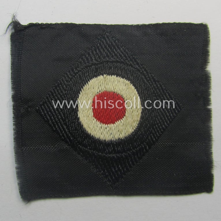 Mid-war-period, WH (Heeres) 'Panzer' cap-eagle & cocarde-set (ie. 'Schiffchenmützen-Adler u. Kokarde-Satz für Mannschaften u. Uffz.') being a 'virtually mint' set as executed in bluish-grey-coloured linnen onto a black-coloured background