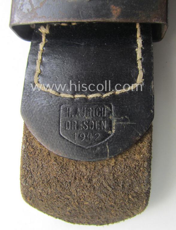 WH (Luftwaffe) bluish-grey-coloured, steel-based belt-buckle being a maker- (ie. 'H. Aurich'-) marked- and/or: '1942'-dated example that comes mounted onto its leather-based tab