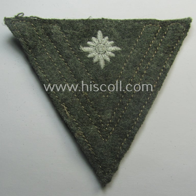 WH (Heeres) 'Armwinkel' (or: arm-chevron) as executed on typical field-grey-coloured wool as was specifically intended for usage by a soldier with the (unusually encountered!) rank of: 'Stabsgefreiter'