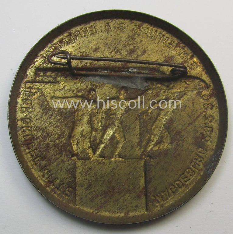 Commemorative, SA- (ie. 'Sturmabteilungen'-) related 'tinnie' being a non-maker-marked example showing three sportsmen and eagle-statue coupled with the text: 'Einweihung S.A.-Ehrenmal der Gruppe Mitte - Magdeburg - 23.2.1936'