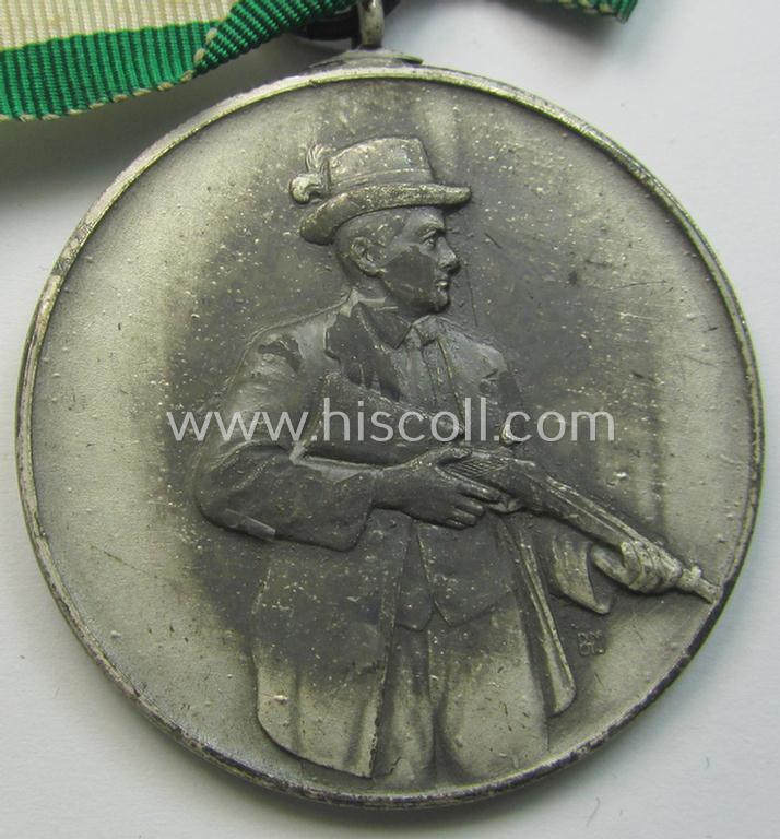 Superb - and most certainly unusually seen! - frosted-silver-toned, TR-period shooting-medal showing on its front a uniformed hunter and that is entitled: 'Vereinsmeister 1939' and that comes mounted onto its 'bow-tie-shaped' ribbon as issued