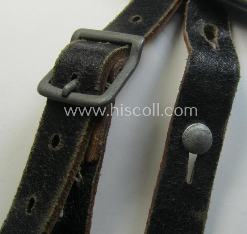 Later-war-period- and 'standard-issue'-pattern, black-coloured- and/or leather-based WH helmet-strap (ie. 'Riemen für Stahlhelm') being an: 'HCH 4'-marked example that comes in a never mounted ie. 'virtually mint' condition