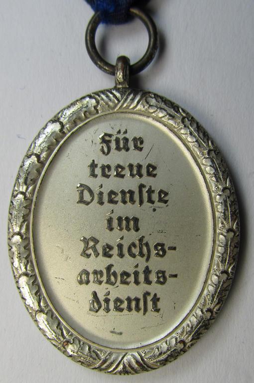 Attractive example of a: RAD (ie. 'Reichsarbeitsdienst') so-called: 'Dienstauszeichnung 3. Stufe für Männer' (as was intended for 12 years loyal-service) and that comes mounted on its period piece of ribbon (ie. 'Bandabschnitt')