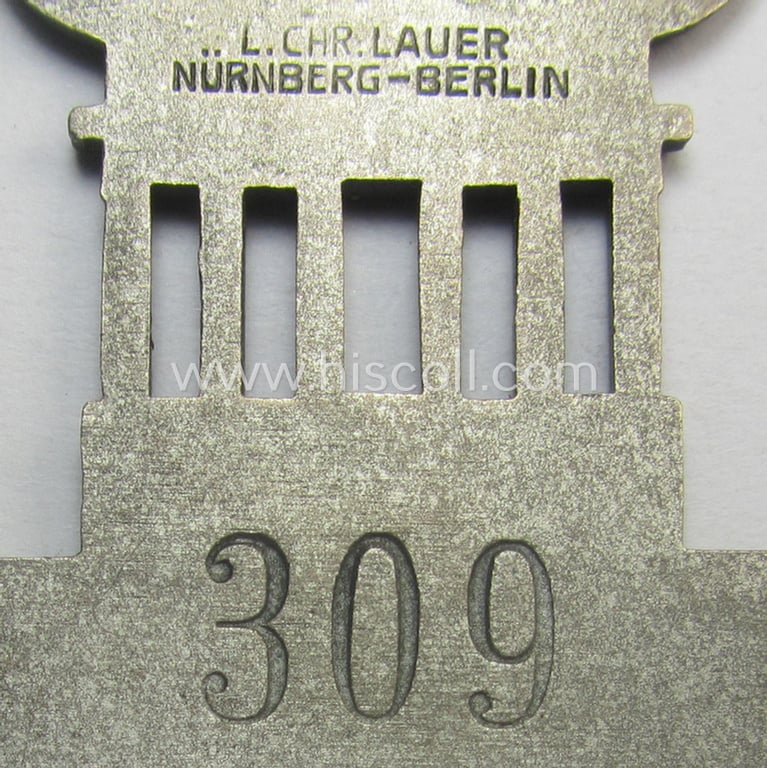 Stunning - and actually never before seen! - 'Richter-Abzeichen' being a maker- (ie. 'L.Chr. Laurer'-) marked example that is showing the Olympic-rings above an illustration of the: 'Reichstag' coupled with a yellow ribbon showing the text: 'Ringen'