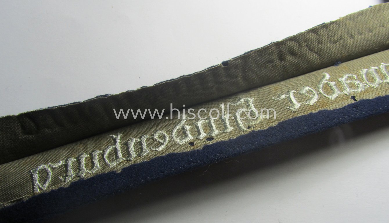 Truly worn, WH (Luftwaffe) cuff-title ie. armband (ie. 'Ärmelstreifen') entitled: 'Geschwader Hindeburg' that comes in a clearly issued- and/or moderately worn, condition