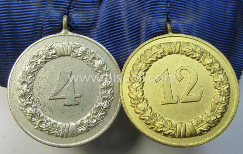 Attractive, two-pieced medal-bar (ie. 'Spange') showing two: WH (Heeres o. Kriegsmarine) so-called: 'Dienstauszeichnungen für 4 u. 12 Jahre Treue Dienste' that both come period-mounted as a so-called: 'Doppelspange'