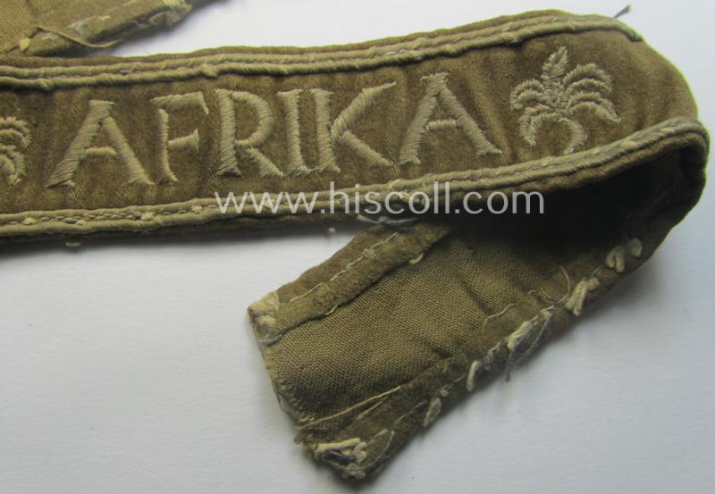 Neat, WH cuff-title (ie. 'Ärmelstreifen') entitled: 'Afrika' that comes in a clearly issued, worn- and/or most certainly once tunic-attached, condition