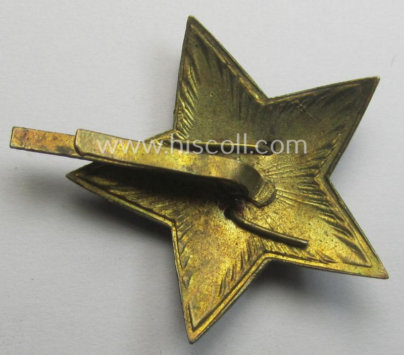 Unusal item that originated from a German soldier: a Russian, larger-sized and/or WWII-period, enamelled star-shaped cap-badge showing the communist logo on a bright-red-coloured surface
