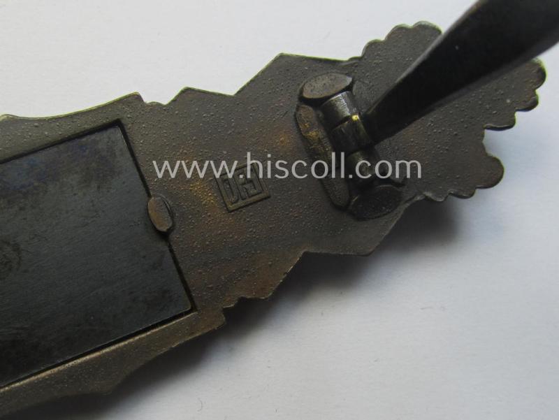 'Nahkampfspange in Bronze' (or: bronze-class close-combat clasp ie. CCC) being a neatly maker-marked- and/or minimally converse-shaped specimen as was produced by the: 'JFS'- (ie. 'Joseph Feix u. Söhne'-) company