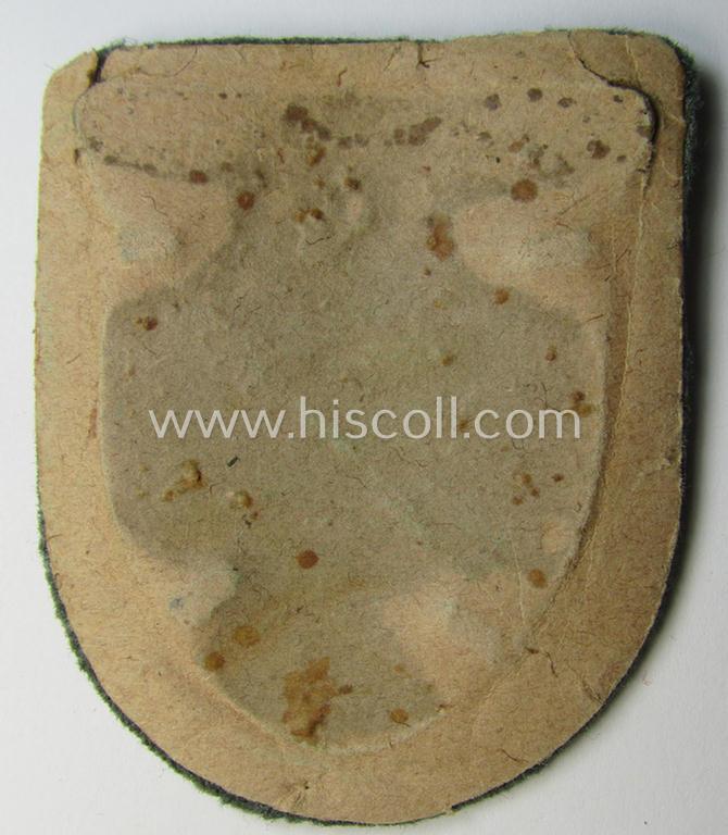 Very attractive - and actually scarcely encountered! - WH (Heeres ie. Waffen-SS) 'Kuban'-campaign-shield that comes mounted onto its original field-grey-coloured- and/or woolen-based 'backing'