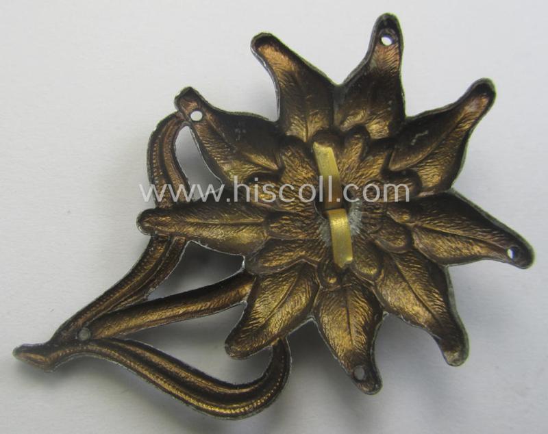 WH (Heeres) (bright) silverish- (ie. golden-) coloured, zinc-based (and neatly maker- ie. 'F&B'-marked) so-called: 'M43'-pattern 'Edelweiss'-cap-badge (ie. 'Mützenabzeichen')