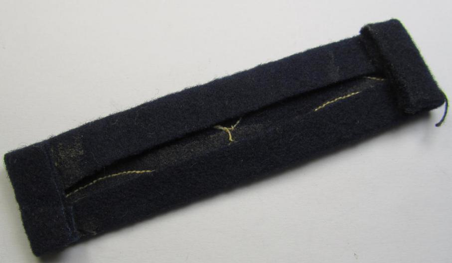 Single, WH (Luftwaffe) beige-coloured- and/or woolen-based, NCO-type rank-patch (aka 'moustache'), as was intended for usage by a non-commissioned officer with the rank of: 'Unteroffizier'