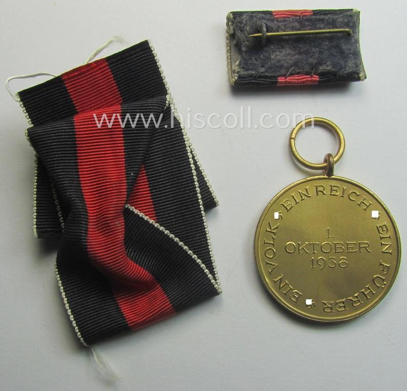 WH Czech-occupation- (ie. 'Anschluss'-) medal: '1. Oktober 1938' being a neat (and virtually mint!) example that came together with its full-length ribbon and single-pieced ribbon-bar as issued and/or recently found