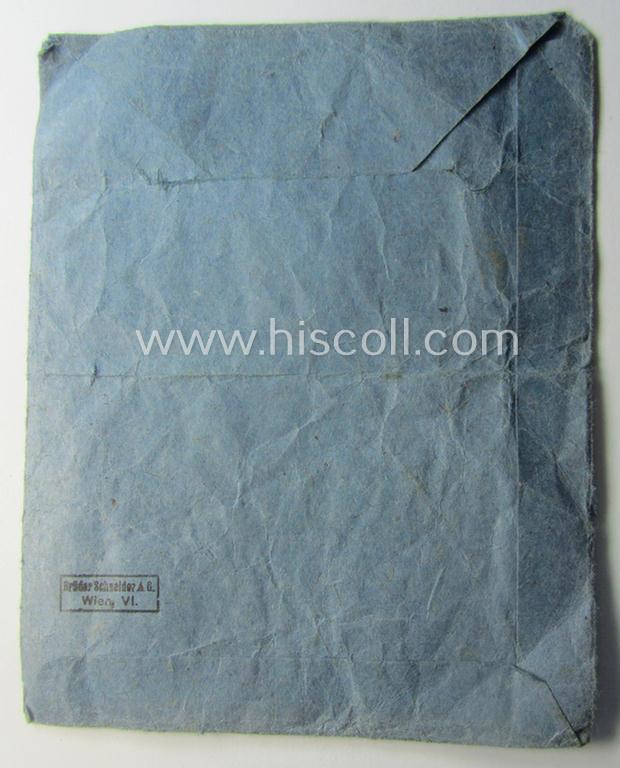 Medal-pouch entitled: 'Eisernes Kreuz 2. Klasse 1939' being a (typical) bluish-coloured example as executed in: 'Zellstoff'-based paper as was produced by the (Austrian) maker- (ie. 'Hersteller'): 'Brüder Schneider A.G. - Wien VI'
