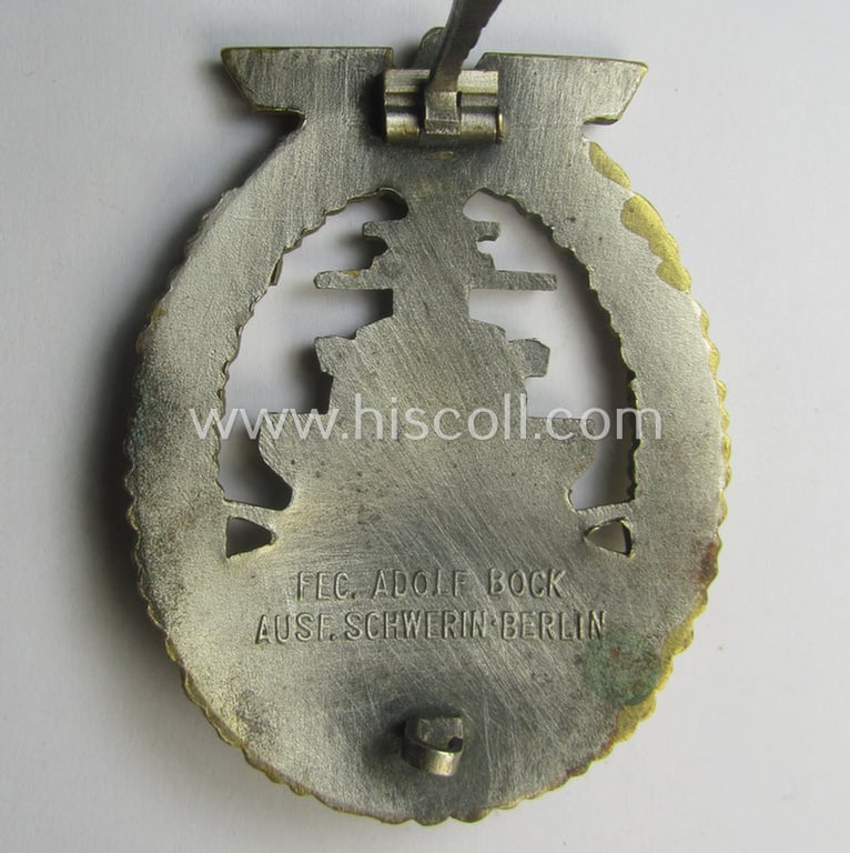 Moderately used, WH (Kriegsmarine) 'Flottenkriegsabzeichen' (or: high-sea fleet badge) being a typical 'Buntmetall'-based specimen that is neatly maker- (ie. 'Fec. Adolf Bock') marked on its back
