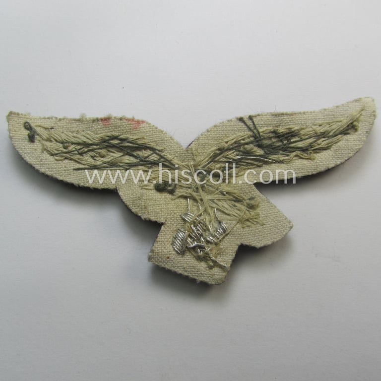'Virtually mint' WH (Luftwaffe) officers'-pattern breast-eagle (ie. 'Brustadler für Offiziere der Luftwaffe') being a neatly hand-embroidered example of the: 'Extra Qualität' that comes in a never used- nor tunic-attached, condition
