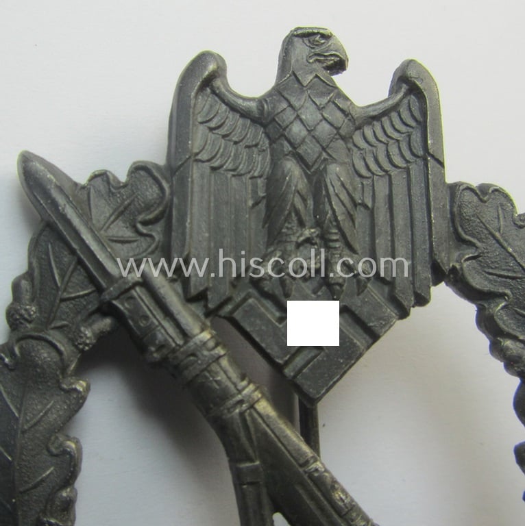 'Infanterie Sturmabzeichen in Silber' being an unmarked, 'variant'-pattern-example as executed in zinc-based, silverish-toned metal (ie. 'Feinzink') as was (presumably) produced by: 'Deschler & Sohn - München'