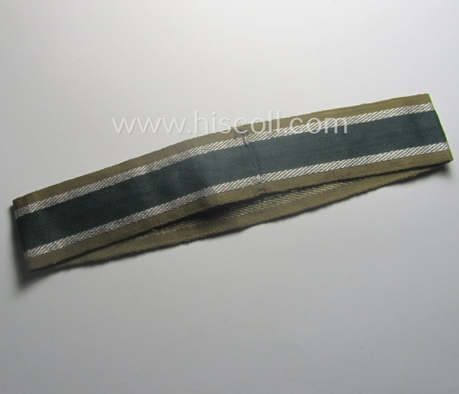 Minimally worn, 'BeVo'-like cuff-title (ie. 'Ärmelstreifen') entitled: 'Afrikakorps' being a with certainty issued example that comes in an overall very nice- (ie. non-shortened- and/or once tunic-attached-), condition