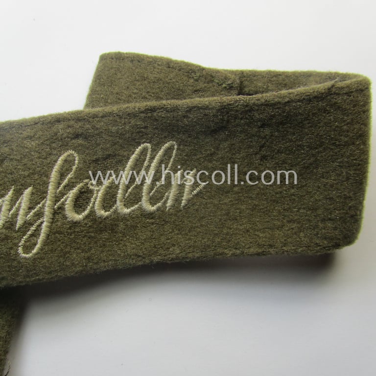 Never before seen - full length and with certainty scarcely encountered! - WH (Heeres) woolen-based so-called: 'FHH-Ärmelstreifen' (ie. cuff-title) as was intended for the soldiers- (ie. NCOs) serving within the: '60. Pz-Gren.-Div.' “Feldherrnhalle”
