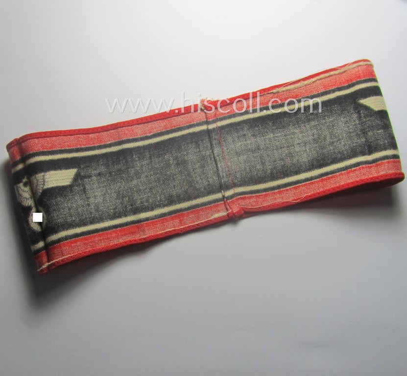 Typically printed- and/or later-war-period, bright-red- and/or black-coloured so-called: 'Deutscher Volkssturm'-armband (ie. 'Armbinde') that comes in an overall nice- (I deem just moderately used- and/or worn-), condition