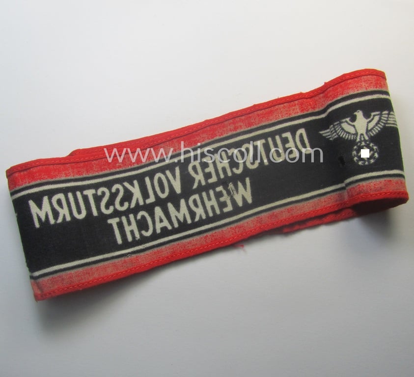 Moderately worn example of a (typically printed- and/or later-war-period) bright-red- and/or black-coloured so-called: 'Deutscher Volkssturm'-armband (ie. 'Armbinde') that comes in an overall nice condition