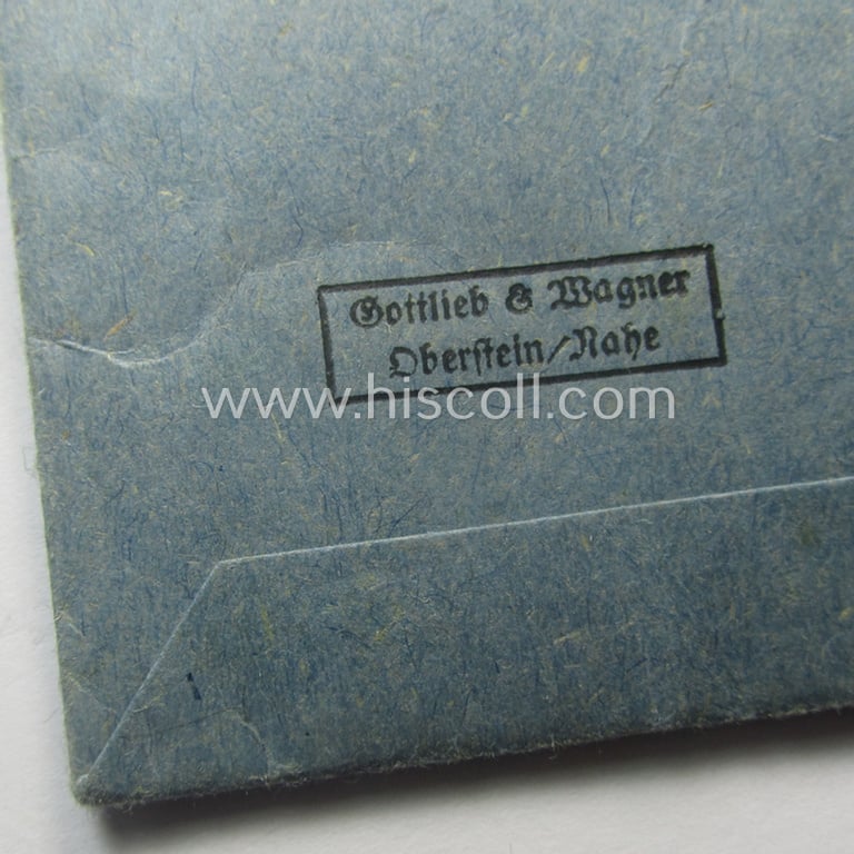 'Ehrenkreuz der deutschen Mutter - zweite Stufe' (or: silver-class mothers'-cross) that came mounted onto its long-sized ribbon and that came stored in its period pouch by the maker: 'Gottlieb & Wagner - Oberstein/Nahe'