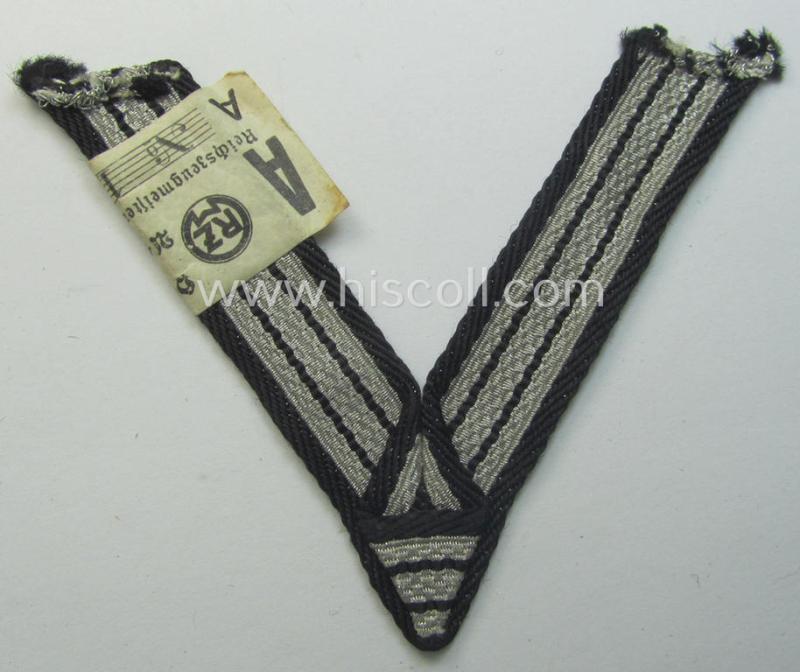 SS (ie. 'Allgemeine o. Waffen-SS') arm-insignia being an 'SS', so-called: 'Ehrenwinkel für Altgediente Kämpfer o. Angehörigen der SS' (or: honorary-chevron for old campaigners) still retaining its period 'RzM'-etiket