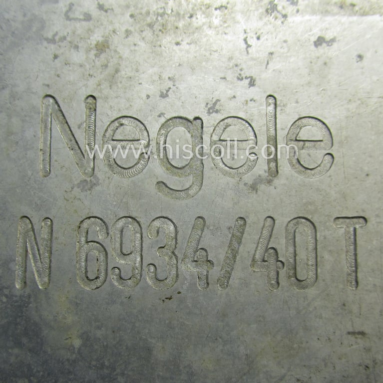 Unusually found, WH (KM) typical aluminium-based- and/or silver toned ID-plaque (for 'on-board-usage') bearing the engraved name and coded numeral (ie. text) that simply reads: 'Negele - N6934/40T'