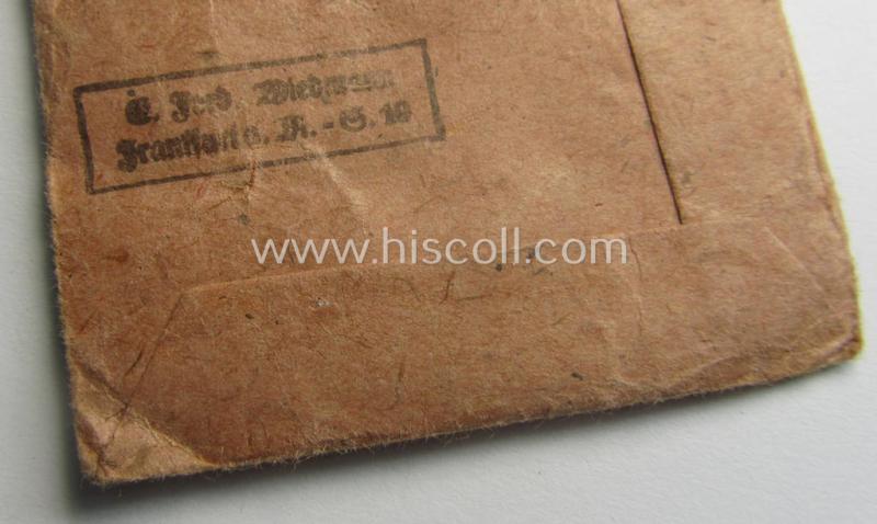 Neatly maker- (ie. '19'-) marked medal: 'Winterschlacht im Osten 1941/42' that came stored in its period pouch by the company: 'E. Ferd. Wiedmann'