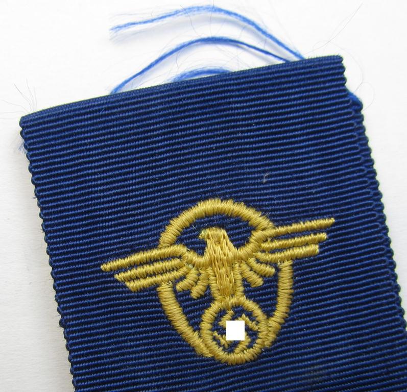 Attractive, golden-class 'Polizei-Dienstauszeichnung 1. Stufe' (or: police loyal-service medal first-class) being a non-maker-marked example that comes together with its accompanying ribbon (ie. 'Bandabschnitt')