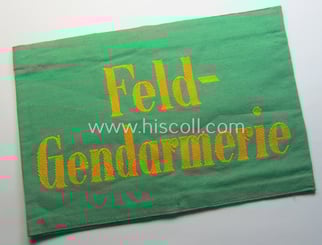 Wehrmacht-related, bright-green-coloured and/or linnen-based armband entitled: 'Feldgendarmerie' (as...