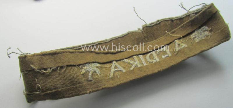Attractive - and clearly worn! - WH cuff-title (ie. 'Ärmelstreifen') entitled: 'Afrika' (being a minimally shortened example that comes in an overall very nice- (ie. issued and clearly worn ie. once tunic-attached-), condition)