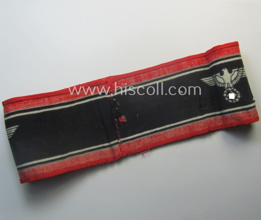 Moderately worn example of a (typically printed- and/or later-war-period) bright-red- and/or black-coloured so-called: 'Deutscher Volkssturm'-armband (ie. 'Armbinde') that comes in an overall nice condition